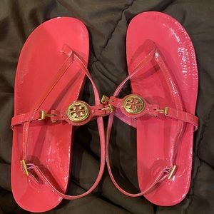 Bright pink Tory Burch sandals with gold logo